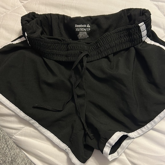 A pair of black running shorts. Has string ties inside. - Picture 2 of 2